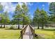 Inviting wooden dock leading to a picturesque lake with lush greenery and a tranquil atmosphere at 16119 Carencia Ln, Odessa, FL 33556