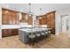 Gourmet kitchen with custom cabinets, a central island with seating, and professional-grade appliances at 16119 Carencia Ln, Odessa, FL 33556