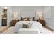 Elegantly styled main bedroom featuring a plush bed, soft lighting, and sophisticated decor at 16119 Carencia Ln, Odessa, FL 33556