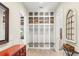 Mudroom with built-in storage, hooks, and a bench at 16119 Carencia Ln, Odessa, FL 33556