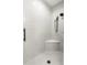 Bright shower with white subway tile surround, mosaic tile floor, and black hardware at 16119 Carencia Ln, Odessa, FL 33556