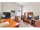 Bedroom featuring a desk and bookshelves, creating an ideal space for work and study at 19106 Abercorn Pl, Lutz, FL 33558