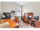 Bedroom featuring a desk and bookshelves, creating an ideal space for work and study at 19106 Abercorn Pl, Lutz, FL 33558
