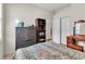 Cozy bedroom with natural light, featuring warm wood furniture, and ample closet space at 19106 Abercorn Pl, Lutz, FL 33558