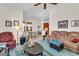 Comfortable living room with open floor plan, including easy access to the kitchen and dining area at 19106 Abercorn Pl, Lutz, FL 33558