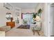 Spacious living room with high ceilings, neutral decor, and sliding glass doors leading to outdoor living space at 19106 Abercorn Pl, Lutz, FL 33558