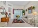 Bright living room with high ceilings, large window, and comfortable white sofa at 19106 Abercorn Pl, Lutz, FL 33558