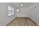 Bright bedroom with hardwood flooring, large window and closet at 1916 Inverness Greens Dr, Sun City Center, FL 33573