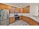 Modern kitchen featuring stainless steel appliances, plenty of cabinet space, and durable countertops at 1916 Inverness Greens Dr, Sun City Center, FL 33573