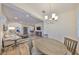 Open-concept living space with wood floors, dining area, comfortable seating, and a seamless flow throughout the home at 1916 Inverness Greens Dr, Sun City Center, FL 33573