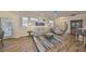 Inviting living room with modern furniture, stylish rug, and plenty of natural light at 1916 Inverness Greens Dr, Sun City Center, FL 33573