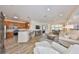 Open-concept living area showcasing seamless flow into the kitchen with modern furnishings at 1916 Inverness Greens Dr, Sun City Center, FL 33573