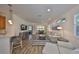 Cozy living room flowing into dining area, complete with stylish furniture and modern decor at 1916 Inverness Greens Dr, Sun City Center, FL 33573