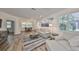 Beautiful living room with elegant decor, hardwood floors, and an abundance of natural light at 1916 Inverness Greens Dr, Sun City Center, FL 33573