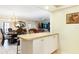 Formal dining room with chandelier, large table, and a connection to the bar area at 2182 Corinne S Ct # C, St Petersburg, FL 33712