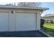 Attached two car garage, matching the home's architecture with neutral tones and a well-maintained exterior at 2182 Corinne S Ct # C, St Petersburg, FL 33712