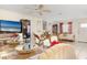 Spacious living room with tile flooring, ornate furnishings, and a large television at 2182 Corinne S Ct # C, St Petersburg, FL 33712