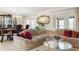 Open-concept living room leading to the dining area, with ornate furniture and ample space at 2182 Corinne S Ct # C, St Petersburg, FL 33712
