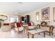 Bright living room featuring tile flooring, ornate furniture, and ample natural light at 2182 Corinne S Ct # C, St Petersburg, FL 33712