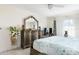 Cozy main bedroom featuring a ceiling fan, a large bed, and plenty of natural light at 2182 Corinne S Ct # C, St Petersburg, FL 33712
