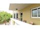 Balcony view with chairs, overlooking palm trees at 2221 Norwegian Dr # 43, Clearwater, FL 33763