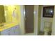 Cozy bathroom featuring a glass door shower, white vanity, and classic toilet at 2221 Norwegian Dr # 43, Clearwater, FL 33763
