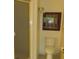 Bathroom with a toilet, shower with a glass door, and framed art at 2221 Norwegian Dr # 43, Clearwater, FL 33763