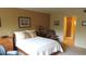 Bedroom featuring natural light, neutral tones, and access to an en-suite bathroom at 2221 Norwegian Dr # 43, Clearwater, FL 33763