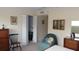 Bedroom featuring a closet, dresser, comfy chair and ceiling fan at 2221 Norwegian Dr # 43, Clearwater, FL 33763