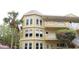The three-story condo building has arched windows and quaint balconies at 2221 Norwegian Dr # 43, Clearwater, FL 33763