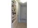 Hallway with built-in shelving to the left and access to other rooms in the home at 2221 Norwegian Dr # 43, Clearwater, FL 33763