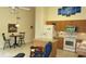 Open kitchen features stainless appliances, light wood cabinets, and a breakfast nook at 2221 Norwegian Dr # 43, Clearwater, FL 33763