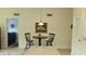 Eat in kitchen with round table under pendant light and stainless steel appliances at 2221 Norwegian Dr # 43, Clearwater, FL 33763