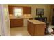 The charming kitchen features wooden cabinets, an island, and lots of counter space at 2221 Norwegian Dr # 43, Clearwater, FL 33763