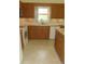 The cozy kitchen features wooden cabinets, modern appliances, and lots of counter space at 2221 Norwegian Dr # 43, Clearwater, FL 33763