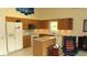 The charming kitchen features wooden cabinets, modern appliances, and an island at 2221 Norwegian Dr # 43, Clearwater, FL 33763