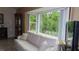 Bright living room has a large window letting in an abundance of natural light at 2221 Norwegian Dr # 43, Clearwater, FL 33763