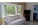 Bright living room with a large window letting in an abundance of natural light at 2221 Norwegian Dr # 43, Clearwater, FL 33763