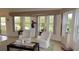 An elegant sitting room features plenty of natural light from large windows and refined decor at 2221 Norwegian Dr # 43, Clearwater, FL 33763