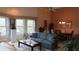 The spacious living room features multiple windows, comfortable seating, and a dining area at 2221 Norwegian Dr # 43, Clearwater, FL 33763