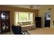 Living room features a bay window with natural light and a view of the outdoors at 2221 Norwegian Dr # 43, Clearwater, FL 33763