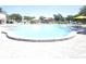 Large swimming pool with surrounding lounge chairs, offering a relaxing and recreational space for residents at 2221 Norwegian Dr # 43, Clearwater, FL 33763