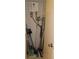 Storage closet containing a tankless water heater, plumbing, and cleaning supplies at 2221 Norwegian Dr # 43, Clearwater, FL 33763