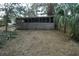 Backyard exterior with dry vegetation. Ready for transformation at 2335 Murilla S Way, St Petersburg, FL 33712