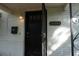 Charming front door with black hardware and brick accents at 2335 Murilla S Way, St Petersburg, FL 33712