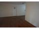 Empty living room with hardwood floors and plain white walls at 2335 Murilla S Way, St Petersburg, FL 33712