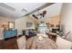 Open-concept living room featuring a fireplace and a balcony at 2515 Bay Blvd # A, Indian Rocks Beach, FL 33785
