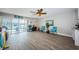 Inviting living room with tile flooring, water views, and access to the outdoor pool area at 2515 Bay Blvd # A, Indian Rocks Beach, FL 33785