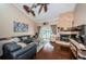 Cozy living room with stone fireplace, hardwood floors, and plenty of natural light at 2515 Bay Blvd # A, Indian Rocks Beach, FL 33785