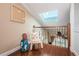 Cozy loft nook with charming nautical decor, skylight, and hardwood floors, creating a relaxing atmosphere at 2515 Bay Blvd # A, Indian Rocks Beach, FL 33785